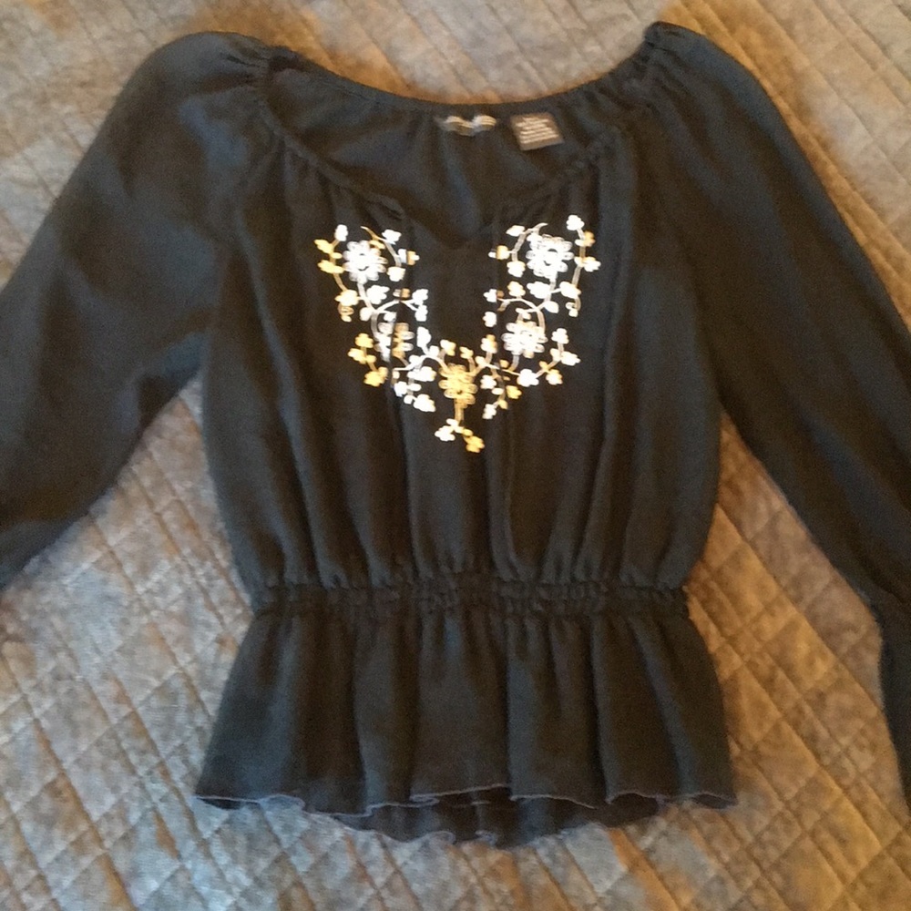 Adorable black top with lots of detail.